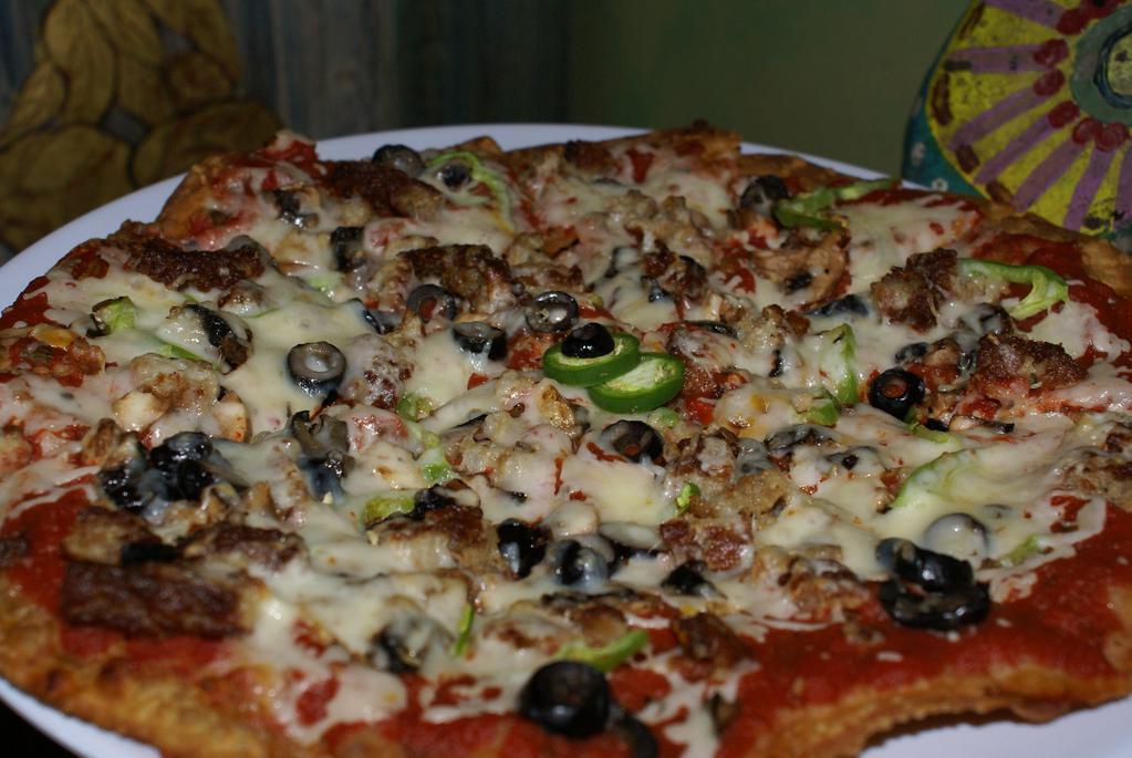 Large Mexican Pizza · Two toasted tortillas, cheese, topped with red sauce, ground beef, tomatoes, onions, and more cheese.