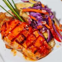 Jerk Chili Salmon · Jamaican jerk salmon glazed with sweet chili sauce and tons of flavor. Paired with roasted p...