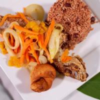 Jamaican Escovitch Fish Special · Wild-caught red snapper fried to perfection and topped with pickled carrots, onions and Scot...