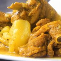 Curry Chicken · One of the Caribbean's most popular dish served with your choice of coconut rice or white rice