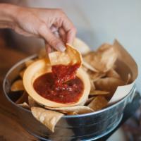 Hand Cut Tortilla Chips · Vegan. Fire-roasted tomato salsa.