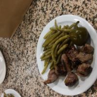 Lamb Tips · Includes garden salad or string beans.