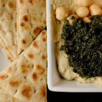 Hummus · Made fresh daily. Served with pita bread.