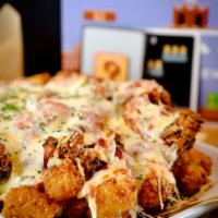 Chicken Parmesan Fries/Tots · Fried Chicken, Marinara and Mozz Cheese over Tots or Fries