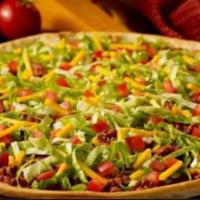 Taco Pizza · Thin crust with picante sauce, beef and taco seasoning, topped with lettuce and cheddar.