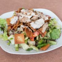 Chicken Shawarma Fattoush Salad · With lettuce, tomatoes, onion, parsley, cucumbers, and toasted pita. Mixed with fattoush dre...