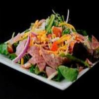 Chop Salad · Fresh seasonal mixed greens, pepperoni, Canadian bacon, salami, red onions, Roma tomatoes, m...