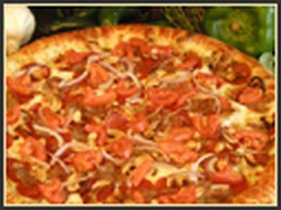 Nutty Chipotle Pizza · Zesty chipotle pesto is topped with spicy Italian sausage, pepperoni, red onions, tomatoes and cashews.