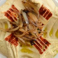 Hummus · Mashed chickpeas blended with fresh made tahini paste, a touch of garlic, spices, lemon juic...
