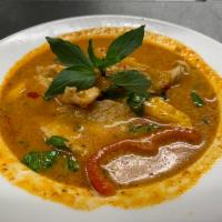 49. Panang Curry · Panang curry paste with coconut milk with finely slice kaffir lime leaf, bell peppers and sw...