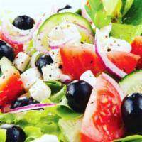 Village Salad · Tomato, cucumber, green peppers, beets, pepperoncini, onion, feta cheese and olives.