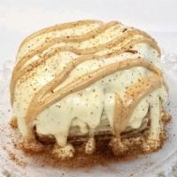 Cinnamon Creme Roll · Rolls topped with Butter Cream Frosting, striped with Cinnamon Butter Cream Frosting and Cin...