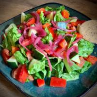 House Salad · Mixed greens, bell peppers, carrots, tomatoes and pickled onions tossed with a balsamic vina...