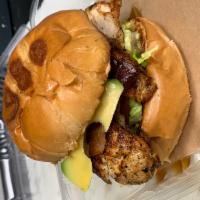 Grilled or Blackened Chicken Sandwich · Grilled or Blackened chicken topped with homemade remoulade, bacon, avocado, lettuce on a br...
