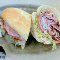 The John's Favorite · Genoa Salami, Ham, Turkey, Bacon, Muenster Cheese, Spicy Mayo, Banana Peppers, Lettuce, Toma...