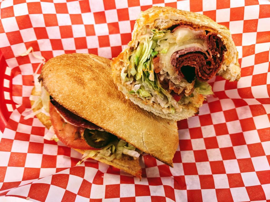 Spicy Italian · Genoa Salami, Hot Capocollo, Pepperoni, Pepper Jack Cheese, Spicy Mayo, Lettuce, Tomatoes, Jalapenos, Red Onions, Salt, Pepper, Oil & Vinegar.