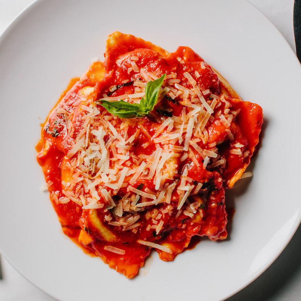 Ravioli Marinara (V) · Homemade ravioli filled with hand-dipped ricotta in a pomodoro sauce. Contains gluten, dairy, nightshades, and eggs. We cannot make substitutions.