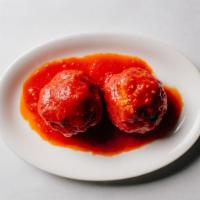 Polpette · 2 homemade meatballs in tomato sauce. Contains gluten, dairy, nightshades, and eggs. We cann...