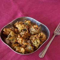 Vegetable Pakoras · An assortment of vegetables dipped in a garbanzo bean flour and deep fried. Gluten free.