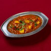 Mutter Paneer · Peas and paneer in a thin tomato based curry.