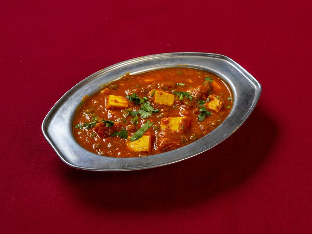 Mutter Paneer · Peas and paneer in a thin tomato based curry.