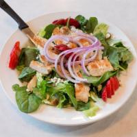 Grilled Chicken Salad · Marinated grilled chicken on a fresh bed of greens with tomato, onion & cucumbers. Served wi...