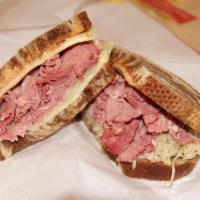  #8. Wells St. Sandwich · Corned beef. Hot thinly sliced homemade corned beef, piled high on rye with mustard. Make it...