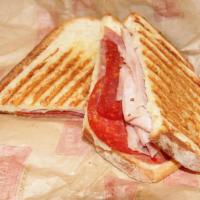 #39. Italian Panini · Salami, pepperoni, ham, provolone cheese, tomato, hot giardiniera, mayo and Italian dressing.