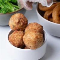 Boudin Balls · Our spin on a Louisiana classic comfort food. Cajun ground pork combined with rice, seasoned...