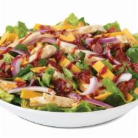 BBQ Chicken Ranch Salad · With bacon, cheddar, tomatoes, onions, BBQ drizzle and ranch dressing. Served with herb toast.