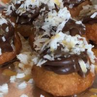 Samoa Donut · Chocolate buttercream with coconut flakes and caramel.
