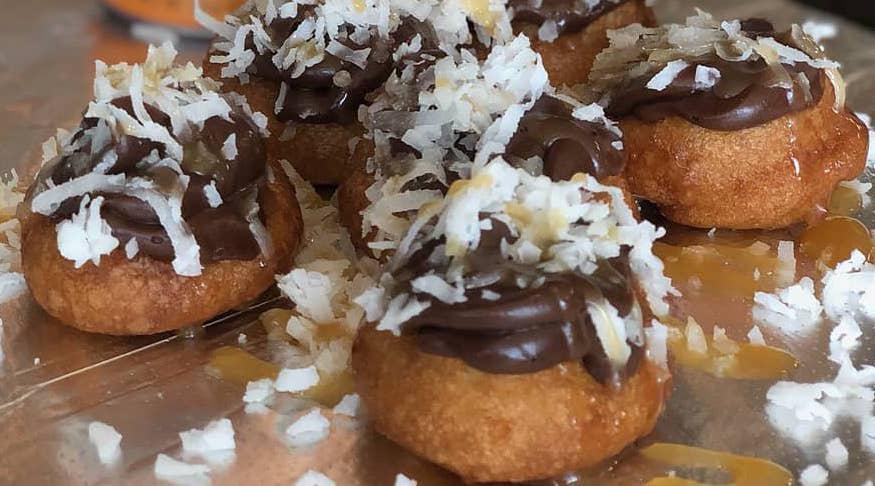 Samoa Donut · Chocolate buttercream with coconut flakes and caramel.
