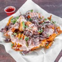 Carne Guisada Loaded Fries · Natural cut fries loaded with cheese, house made chipotle aioli, carne guisada, curtido, and...