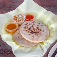 Pupusas · A hand-crafted Salvadoran thick corn tortilla stuffed with your choices below. Served with o...