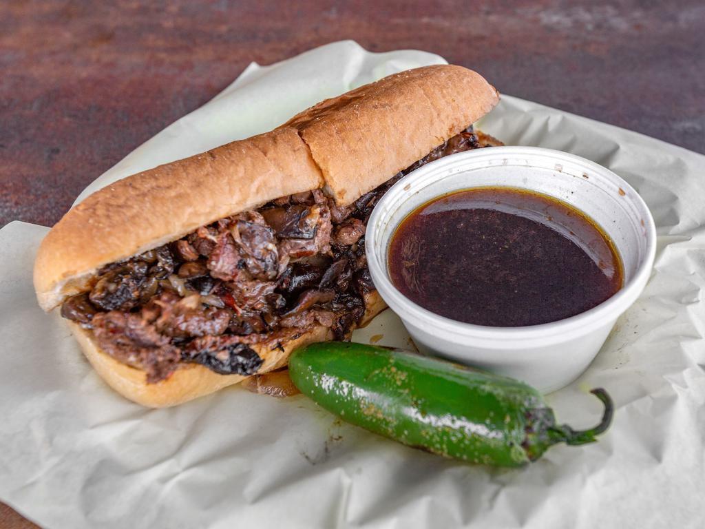 French Dip Sandwich · Thin sliced flank steak caramelized onions, portabella mushroom, and brie cheese served on a soft roll with au jus dip.