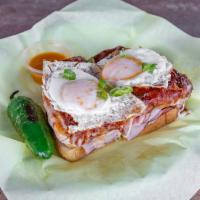 Croque Madame · A classic French sandwich made with fresh sliced ham, layered with bechamel sauce (milk thic...