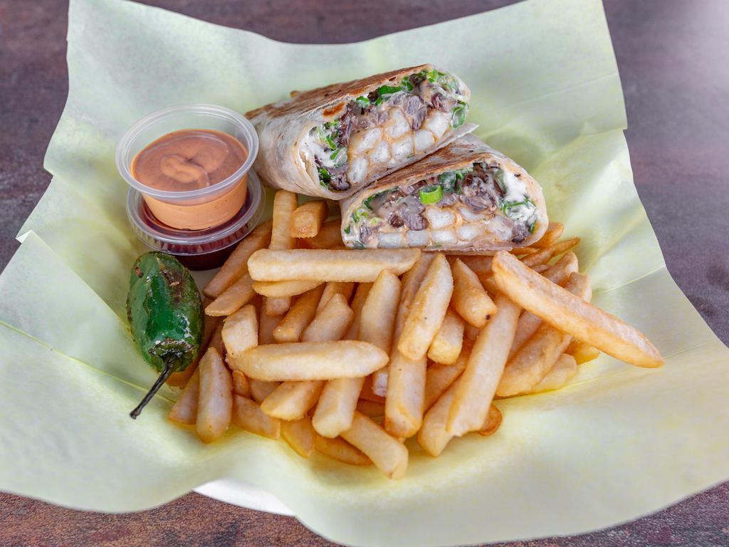 French Matelas · A flour tortilla grilled, folded, and filled with a combination of meats, creamy cheese sauce, and french fries.