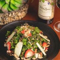 Insalata di Cavlo Riccio · Baby kale, strawberries, apple slices and roasted almond with a homemade sweet balsamic dres...