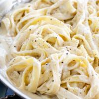 Linguine Alfredo · Roasted garlic and light cream sauce.