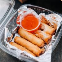 Spring Rolls · Hand rolled spring rolls made in house served with pineapple sweet chili dipping sauce.  3 S...