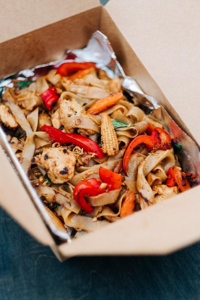 Drunken Noodle · Also known as Pad Kee Mao - This Thai dish consists of wide rice noodles wok fried with special blend of stir fry sauce, fresh garlic, shallot, chili, Thai basil, red bell pepper, baby corn, mushrooms, and egg. 

Tuk Tuks #1 seller 