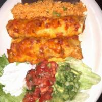 Mexican Enchiladas · 2 tortillas stuffed with shredded chicken or beef topped with sauce and melted cheese served...