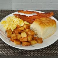 Breakfast Plate · Grits, eggs, cheese, bacon or sausage.