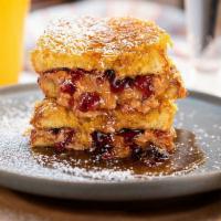PB+J Cornflake French Toast · classic pb+j sandwich with grape jelly, dipped in french toast batter, crusted in cornflakes...