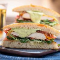 Grilled Chicken Sandwich · grilled chicken with cheddar, nitrate free bacon, arugula, tomato, tarragon mayo, served on ...