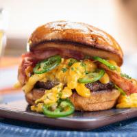 Dirty Mac Burger · 6oz signature burger patty, cheddar mac n cheese, jalapeno, bacon, brioche bun. Served medium.