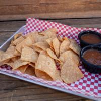 Chips And Salsa · Fresh cut totopos chips, homemade salsa roja