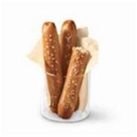 Pretzel Sticks with Zesty Queso · Soft pretzel sticks served hot from the oven and topped with salt and served with warm zesty...