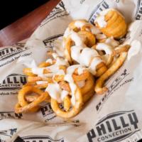 Cheese Fries · Casa Blanca Cheese sauce on either curly or regular fries