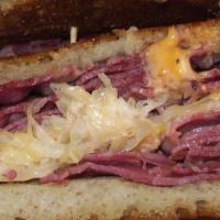 Reuben Melt · The long lasting favorite is piled high with thinly sliced corned beef, Thousand Island, sau...